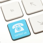 A keyboard button with the words "contact us" written on it.